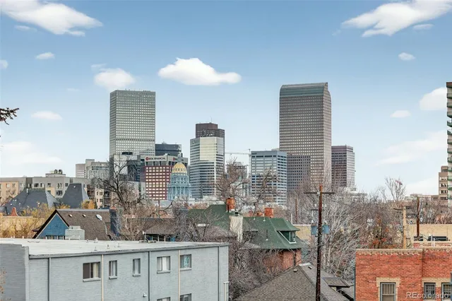 a view of city with tall buildings