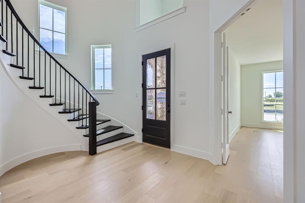 2620 Cedar Rdg Road Celina, TX 75009 - Photo 2 of 27 Entryway with wood finished floors, stairs, and a towering ceiling