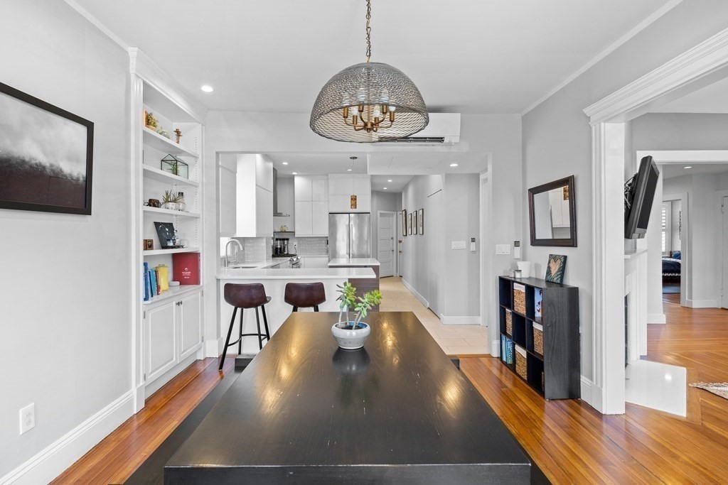 23 Strathmore Road, Unit 3 Brookline, MA 02445 - Photo 11 of 26 a living room with stainless steel appliances lots of furniture and kitchen view