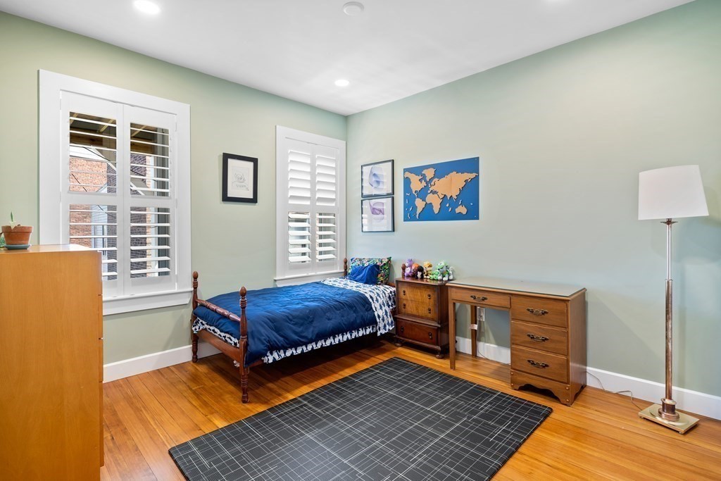 23 Strathmore Road, Unit 3 Brookline, MA 02445 - Photo 15 of 26 a living room with furniture and a window