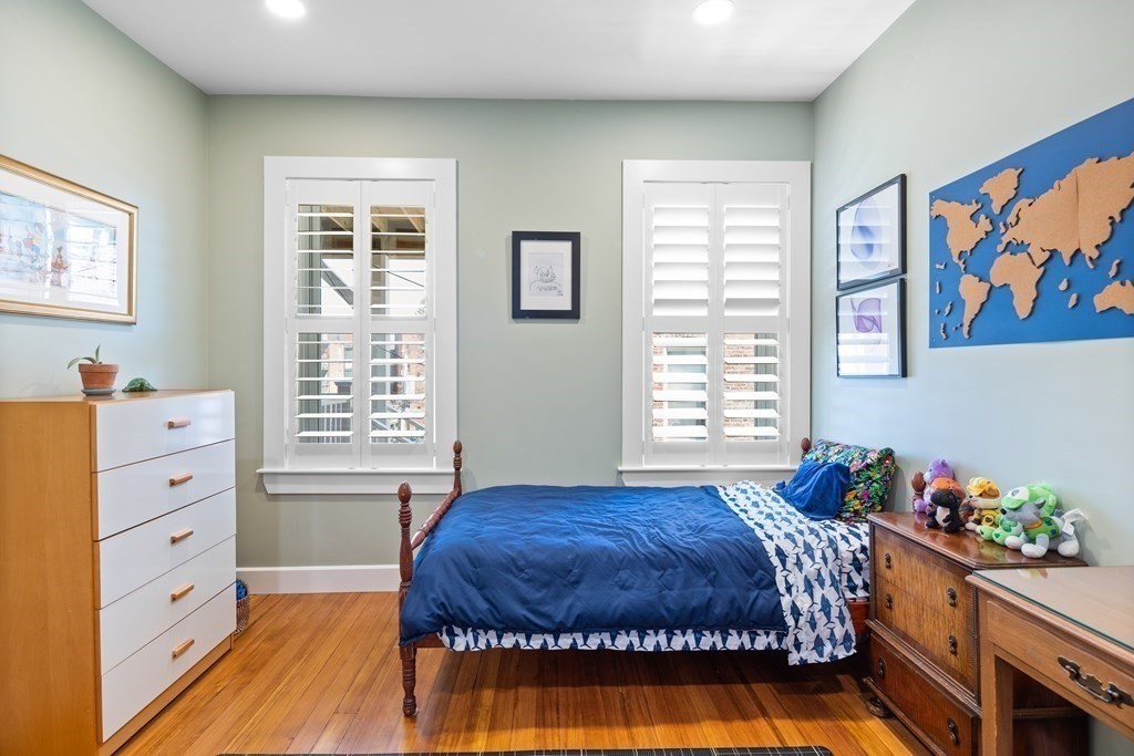 23 Strathmore Road, Unit 3 Brookline, MA 02445 - Photo 16 of 26 a spacious bedroom with a bed and a window in it