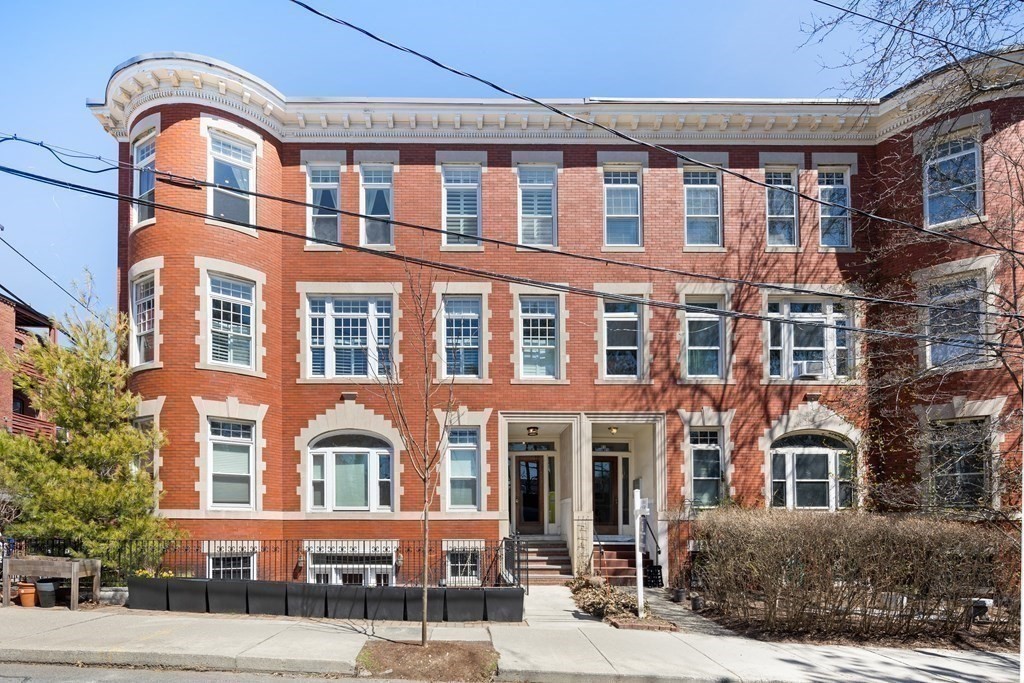23 Strathmore Road, Unit 3 Brookline, MA 02445 - Photo 25 of 26 a front view of a building with a garden
