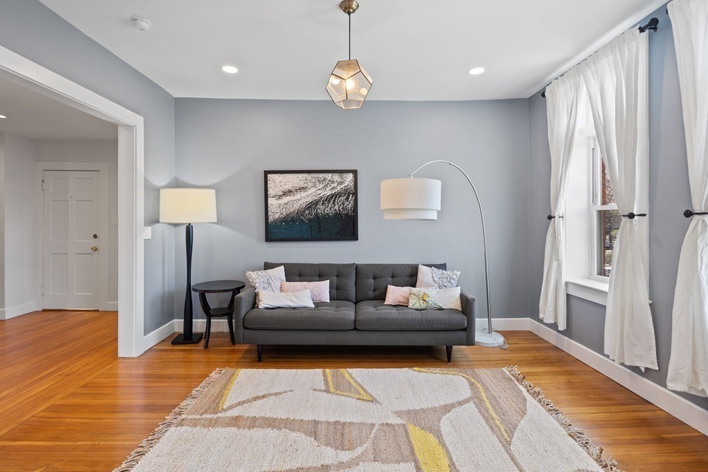 23 Strathmore Road, Unit 3 Brookline, MA 02445 - Photo 7 of 26 a living room with furniture and a table
