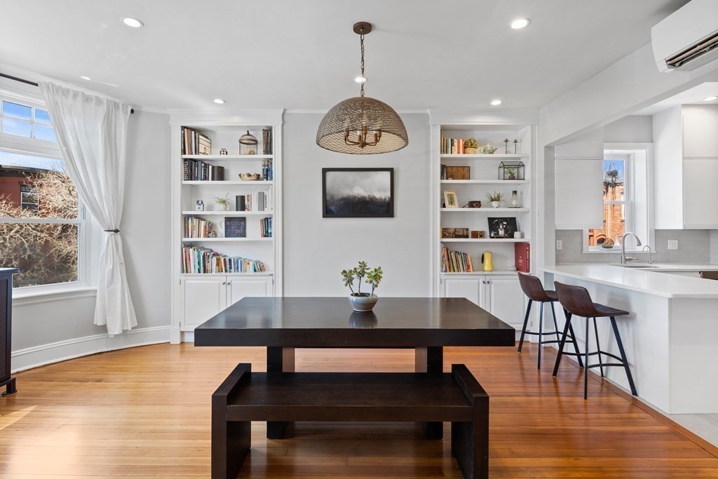 23 Strathmore Road, Unit 3 Brookline, MA 02445 - Photo 10 of 26 a view of a dining room with furniture window and wooden floor