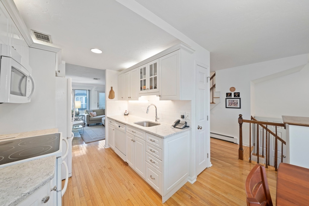 84 Walpole Street, Unit 7M Canton, MA 02021 - Photo 6 of 31 a large white room with cabinets