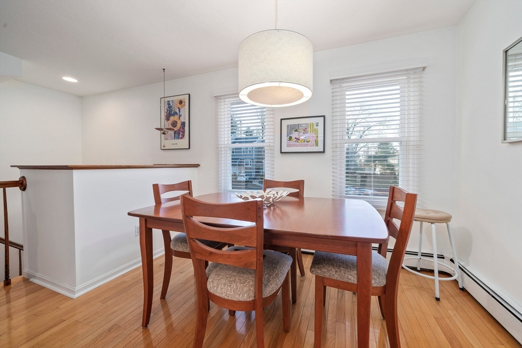 84 Walpole Street, Unit 7M Canton, MA 02021 - Photo 10 of 31 a view of a dining room with furniture and wooden floor