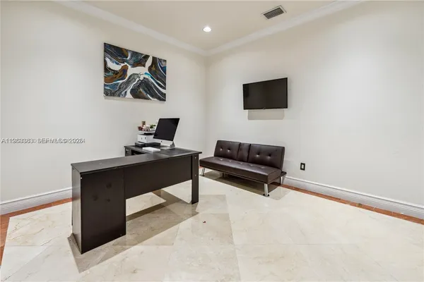 a bedroom with a bed and a night stand