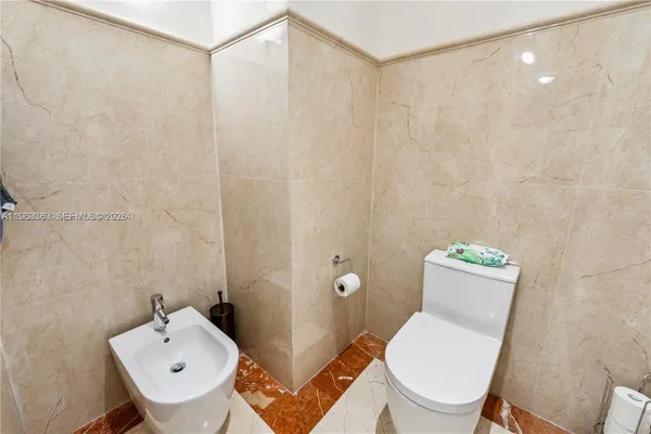 an aerial view of a house with a yard and potted plants