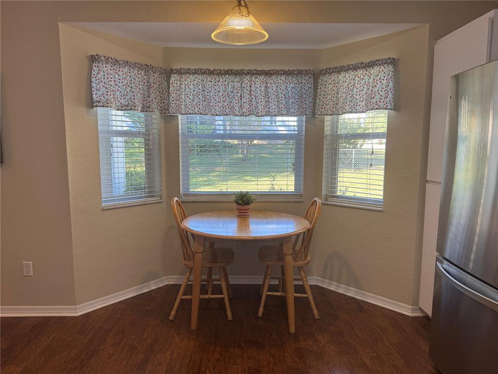 6071 Southwest 105th Place Ocala, FL 34476 - Photo 6 of 13 a dining room with furniture and window