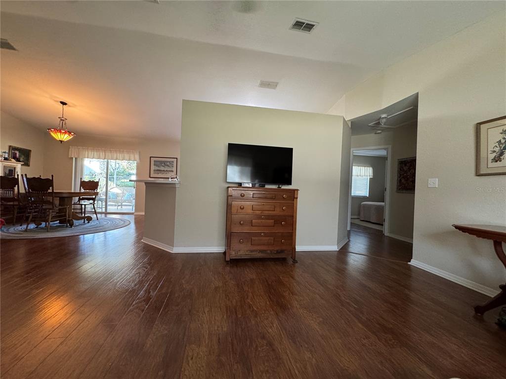 6071 Southwest 105th Place Ocala, FL 34476 - Photo 10 of 13 a living room with furniture and a flat screen tv