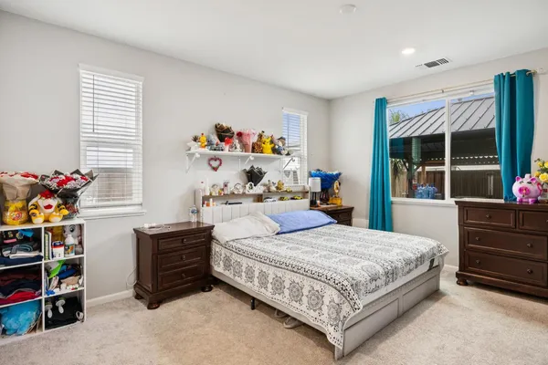 a bathroom with a tub a sink a mirror and a shower