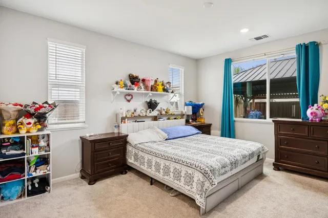 a bathroom with a tub a sink a mirror and a shower