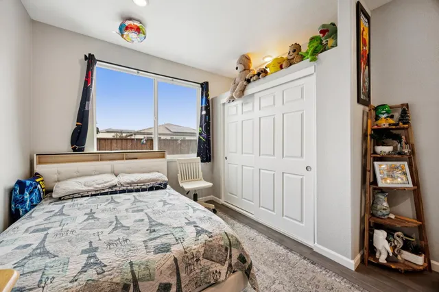 a bed room with a bed and a tv