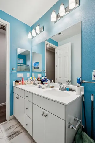 a bedroom with a bed and walk in closet