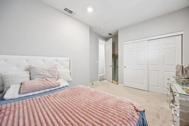 a bathroom with a sink vanity mirror bathtub shower and toilet