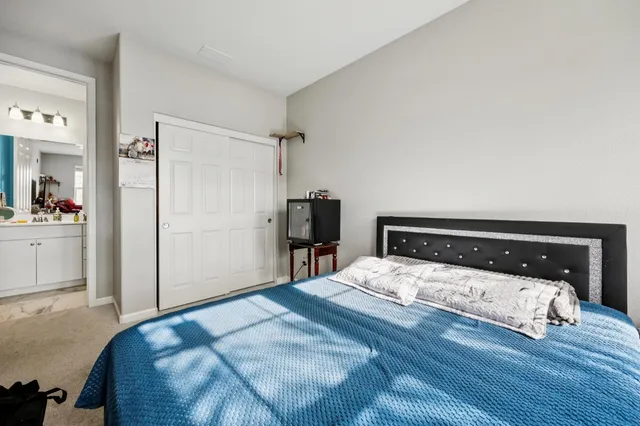 a bathroom with a double vanity sink mirror and toilet