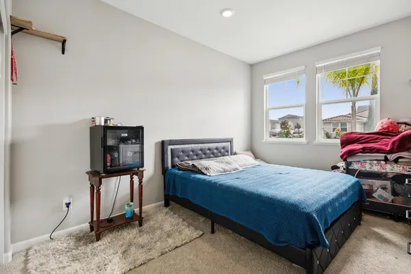 a bathroom with a sink mirror and vanity