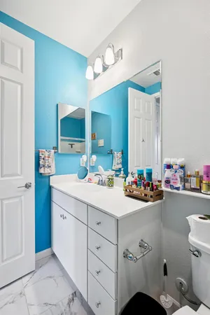 a utility room with dryer washer and shoe rack