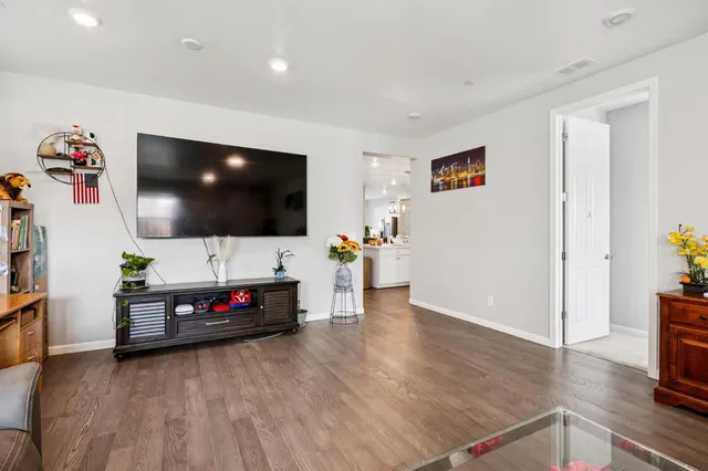 a kitchen with a sink a stove and chairs