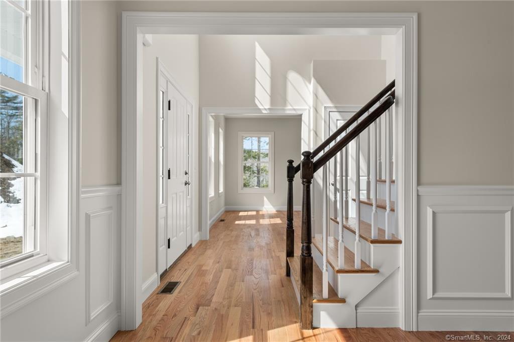 116 Holcomb Hill Road New Hartford, CT 06057 - Photo 5 of 30 Standard trim, applique moldings, stair rail and oak tread staircase