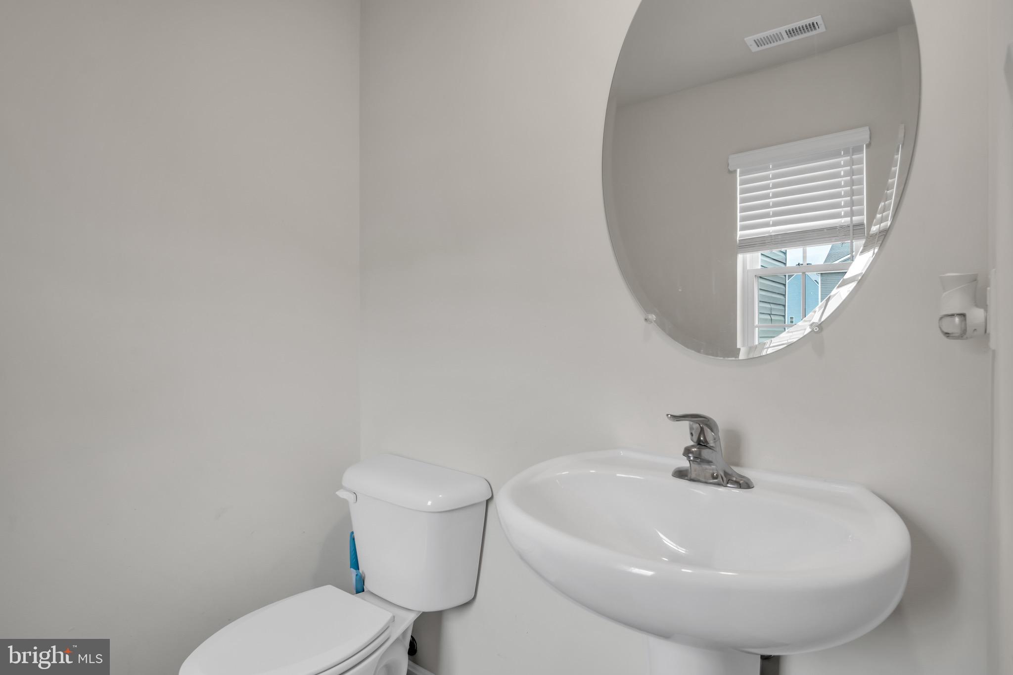 18 Smokehouse Road Carlisle, PA 17013 - Photo 13 of 33 a bathroom with a toilet a sink and mirror
