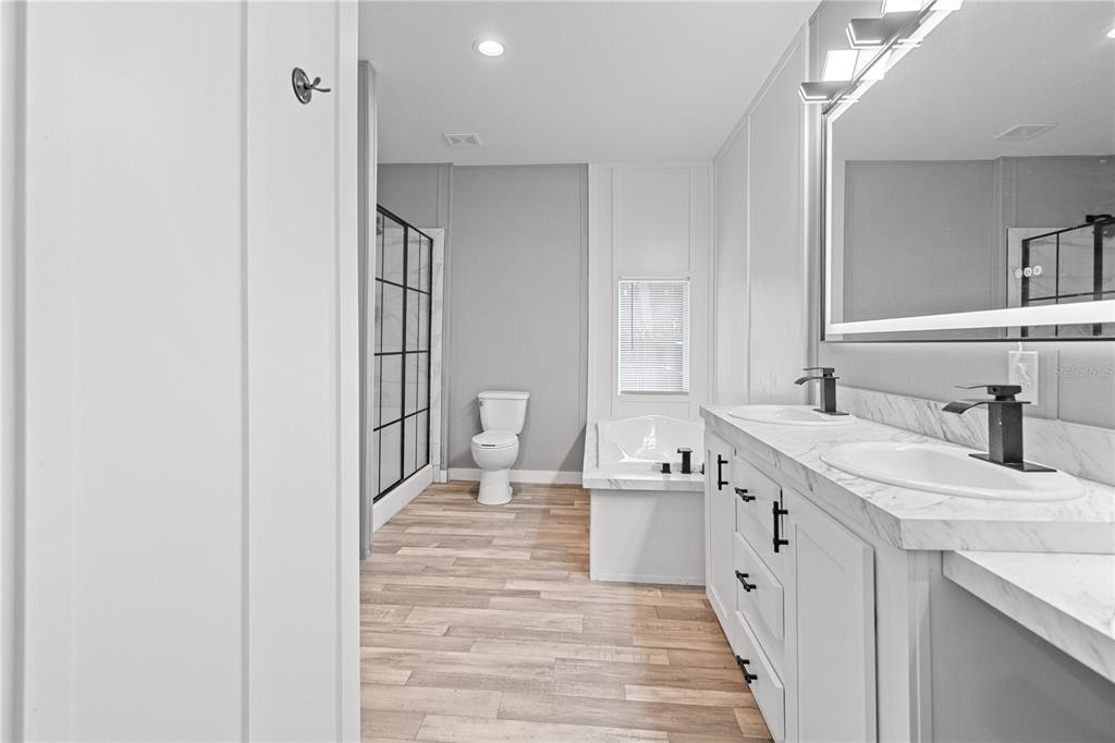 375 Sapp Street Inglis, FL 34449 - Photo 16 of 36 a bathroom with a sink a toilet and shower