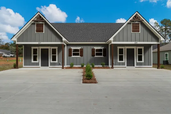 a front view of the house with outdoor space