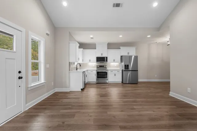 a view of kitchen with wooden floor