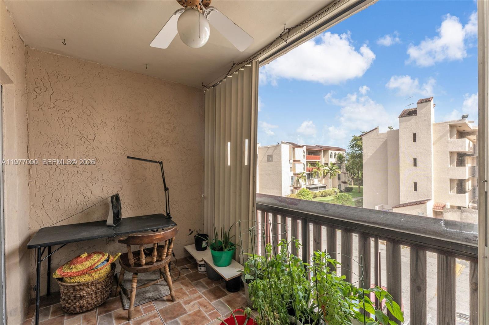 10641 Southwest 108th Avenue, Unit 3D Miami, FL 33176 - Photo 12 of 26 a window and a table in a room