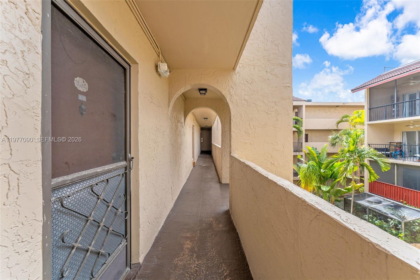 10641 Southwest 108th Avenue, Unit 3D Miami, FL 33176 - Photo 23 of 26 a view of a balcony with potted plants