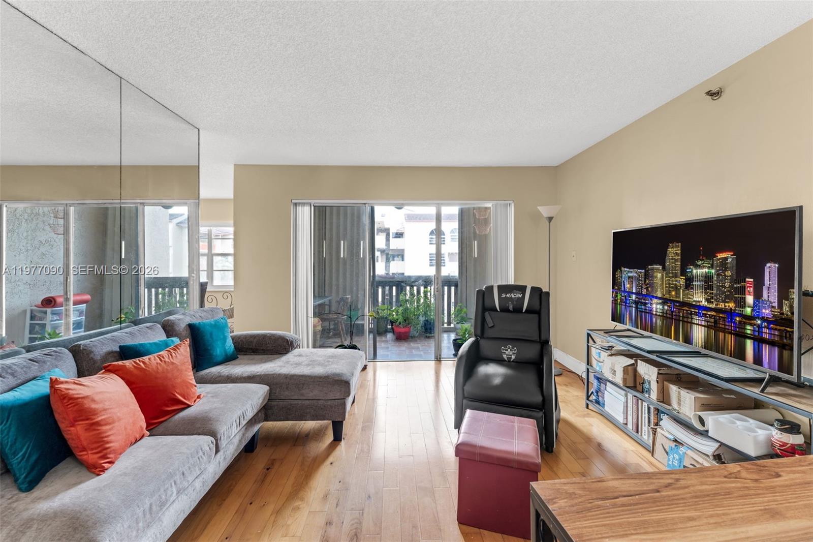 10641 Southwest 108th Avenue, Unit 3D Miami, FL 33176 - Photo 3 of 26 a living room with furniture and a wooden floor