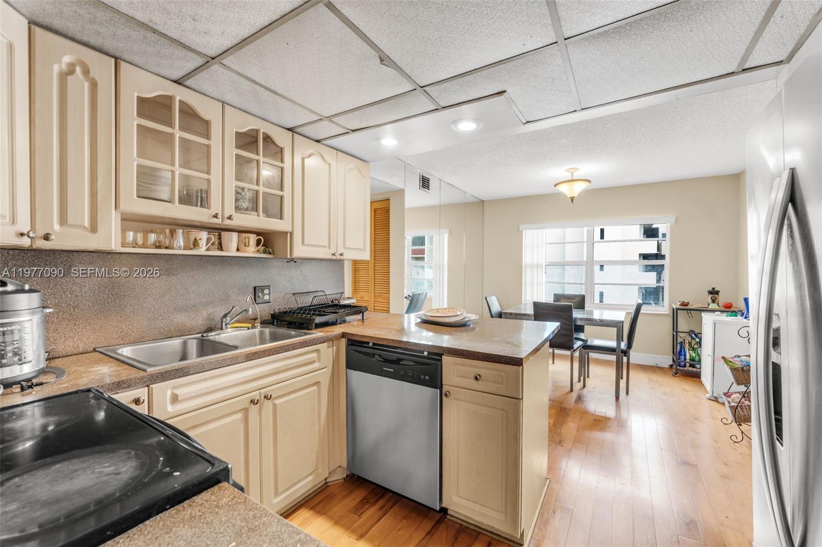 10641 Southwest 108th Avenue, Unit 3D Miami, FL 33176 - Photo 8 of 26 a kitchen with stainless steel appliances granite countertop a stove and cabinets
