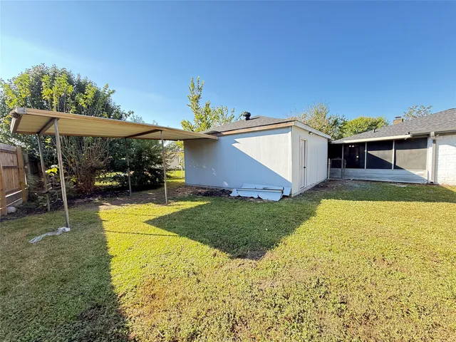 a view of a backyard with swimming pool