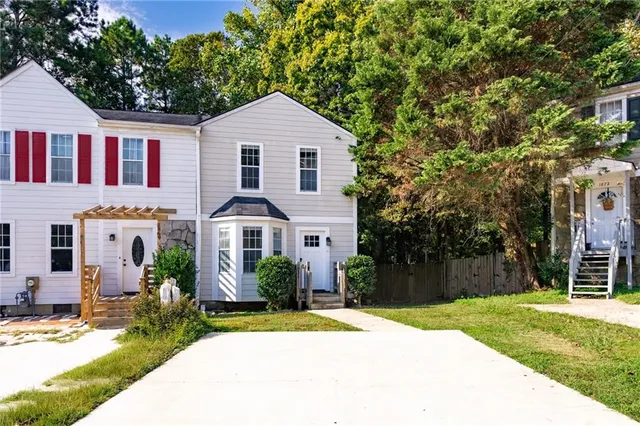 a front view of a house with a yard
