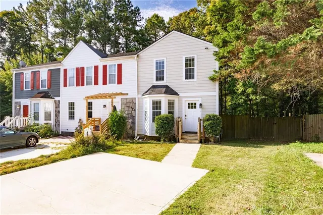 a front view of a house with a yard