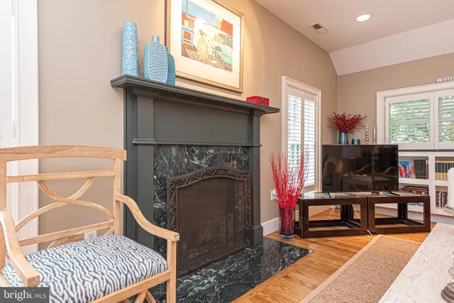 a kitchen with counter space and wooden floor
