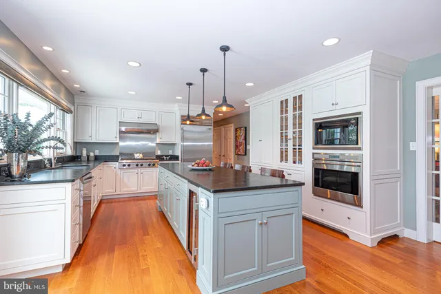 a spacious bedroom with a bed and a large window