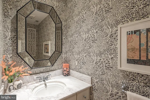 a view of a lake with boats and trees in the background