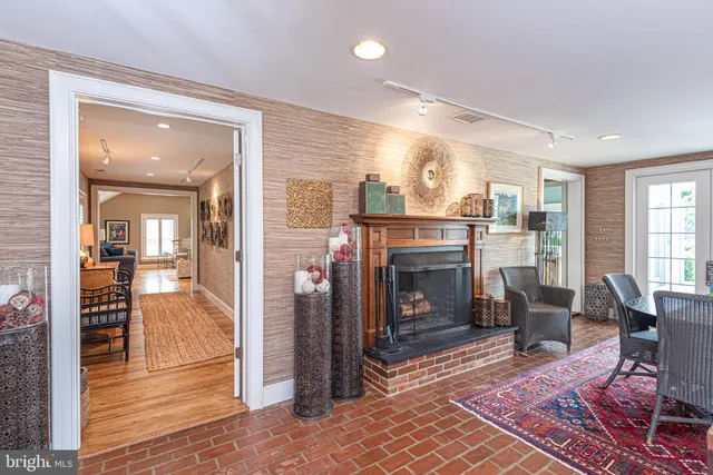 a living room with furniture fireplace and a fireplace