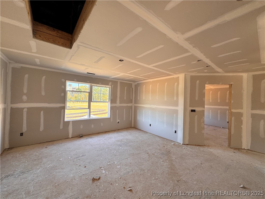 271 Elijah Way Vass, NC 28394 - Photo 12 of 28 an empty room with windows
