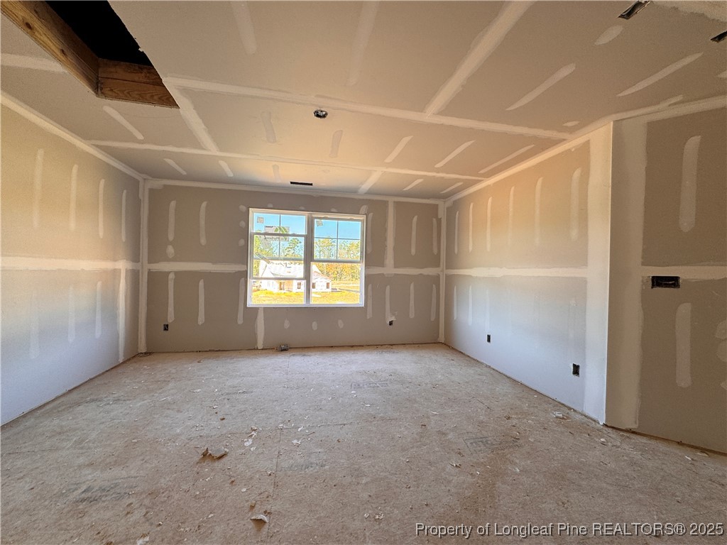 271 Elijah Way Vass, NC 28394 - Photo 18 of 28 an empty room with windows