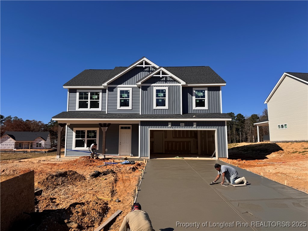 271 Elijah Way Vass, NC 28394 - Photo 2 of 28 a front view of a house with parking space