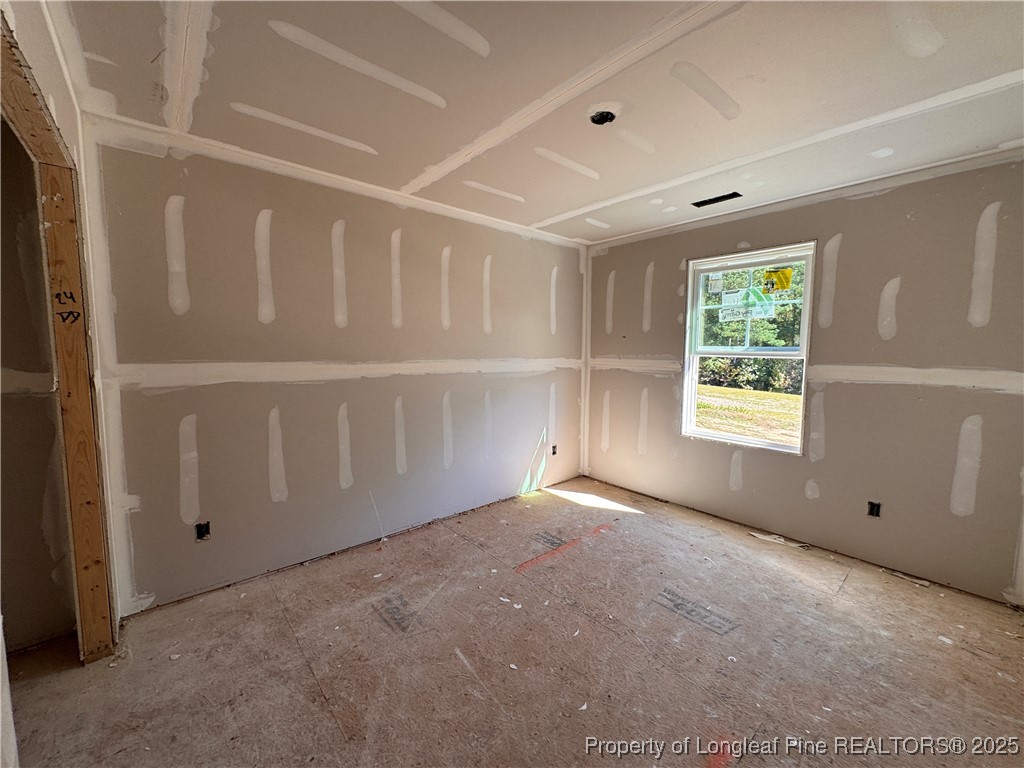 271 Elijah Way Vass, NC 28394 - Photo 22 of 28 an empty room with windows
