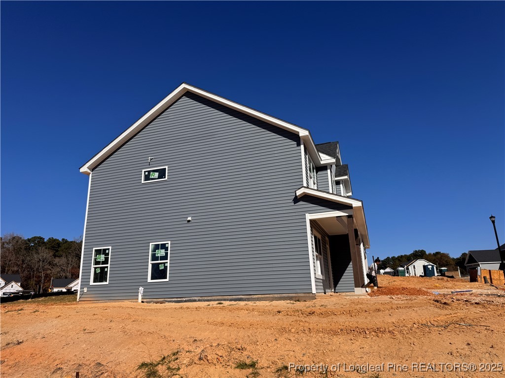 271 Elijah Way Vass, NC 28394 - Photo 27 of 28 a view of a house with snow on the background