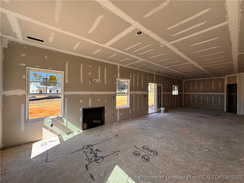 271 Elijah Way Vass, NC 28394 - Photo 8 of 28 an empty room with windows