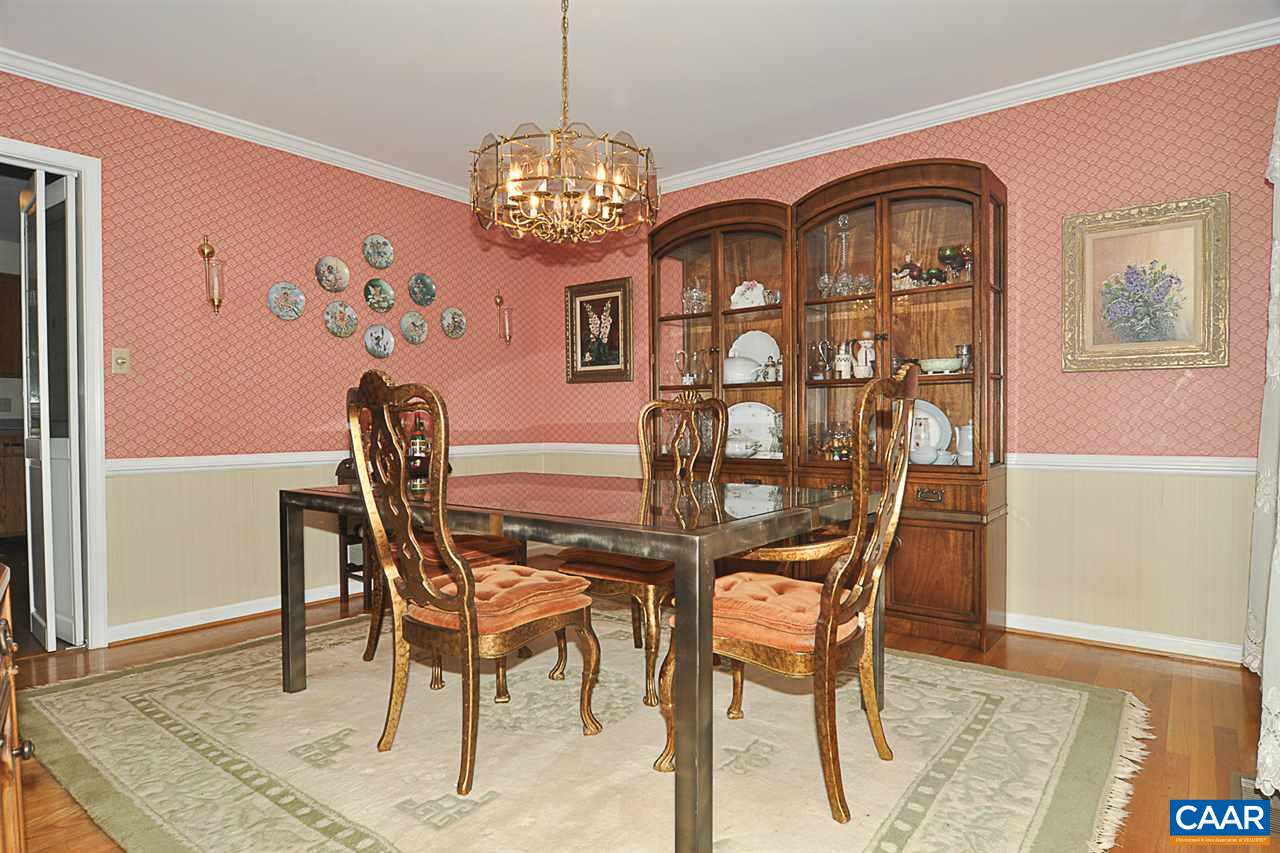 2424 Thrush Road Charlottesville, VA 22901 - Photo 14 of 25 a view of a dining room with furniture and chandelier