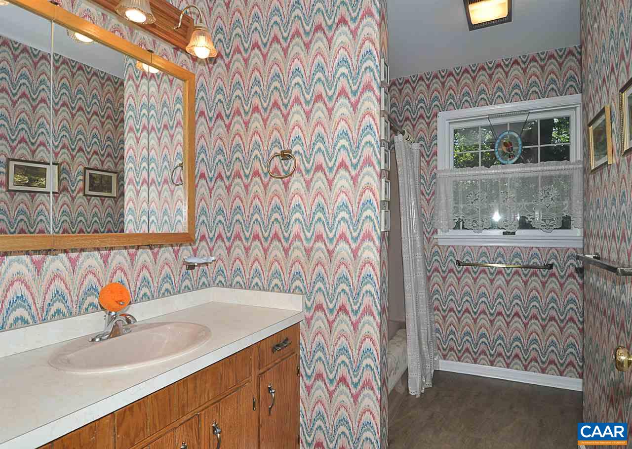 2424 Thrush Road Charlottesville, VA 22901 - Photo 19 of 25 a bathroom with a sink and a mirror