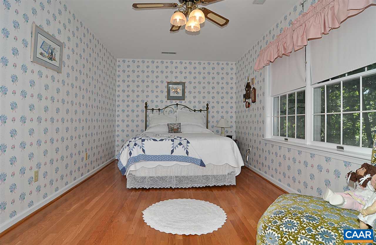 2424 Thrush Road Charlottesville, VA 22901 - Photo 21 of 25 a bedroom with a bed and a window