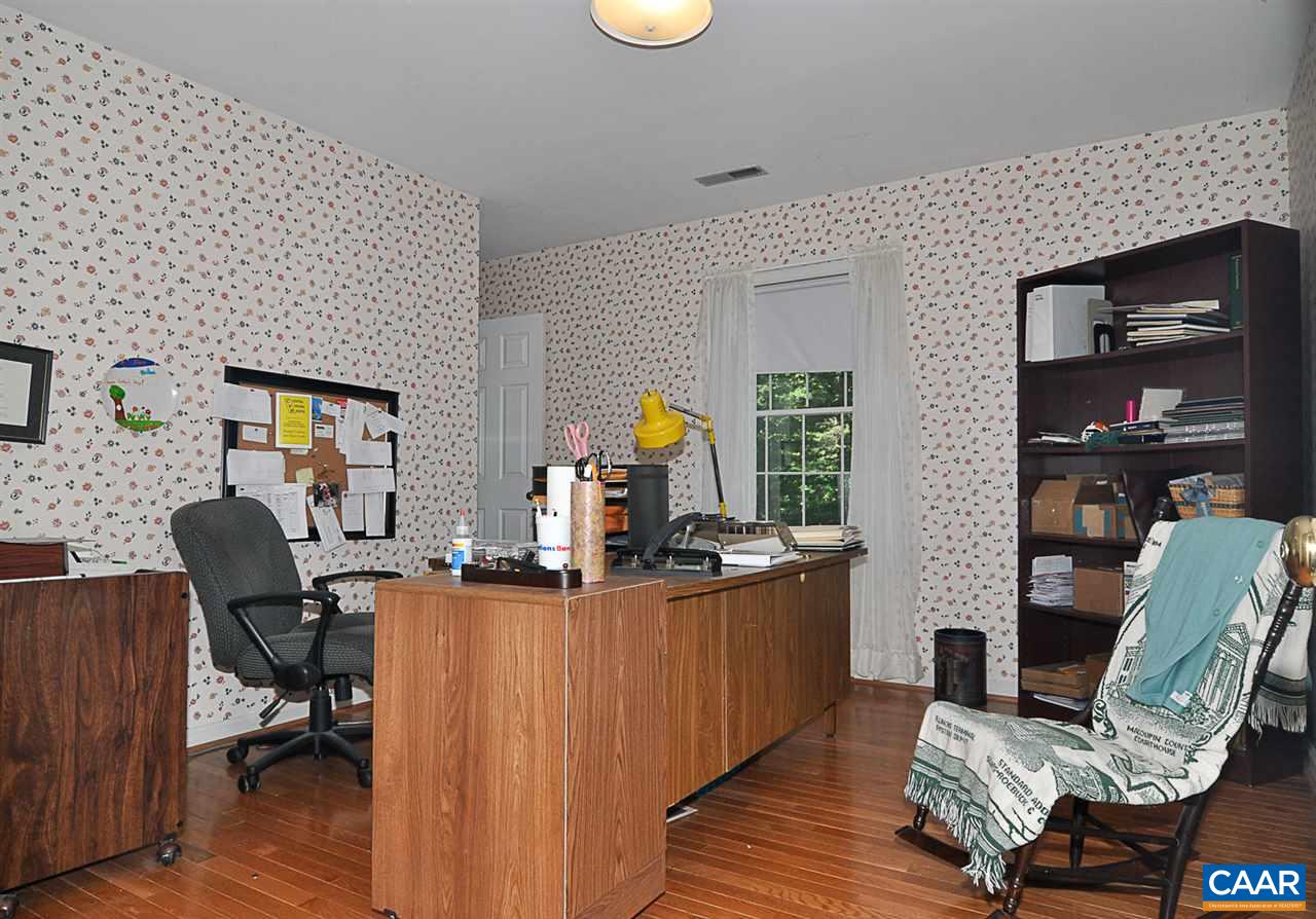 2424 Thrush Road Charlottesville, VA 22901 - Photo 24 of 25 a view of a workspace with furniture and lounge chair
