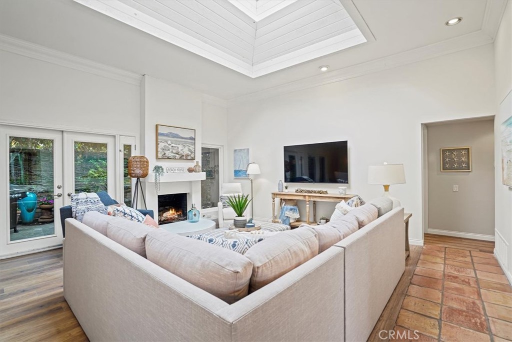 23802 Cassandra Bay Dana Point, CA 92629 - Photo 17 of 56 a living room with furniture a flat screen tv and a fireplace